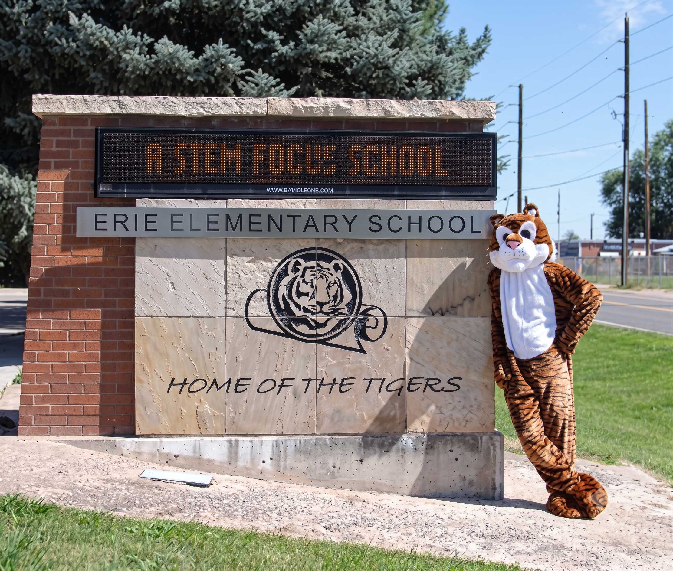 Erie Elementary School entrance sign reading 'Home of the Tigers' with the Tiger mascot